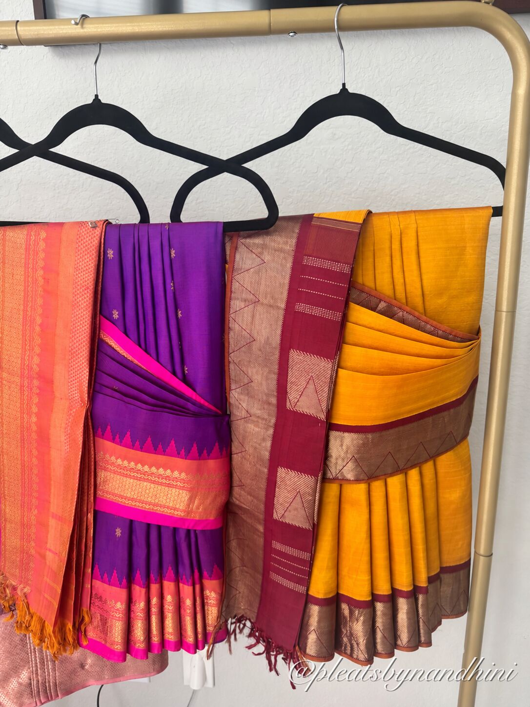 Peach silk saree folded with neat pleats